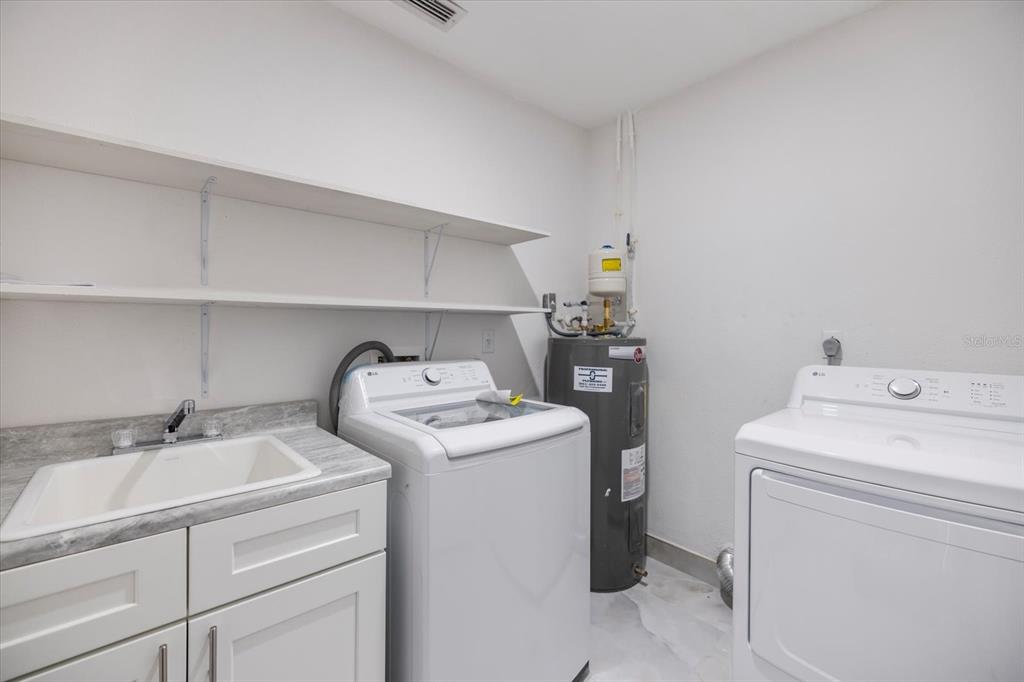 470 Leger Drive Nokomis, FL 34275 - Photo 36 of 51 a utility room with dryer and washer