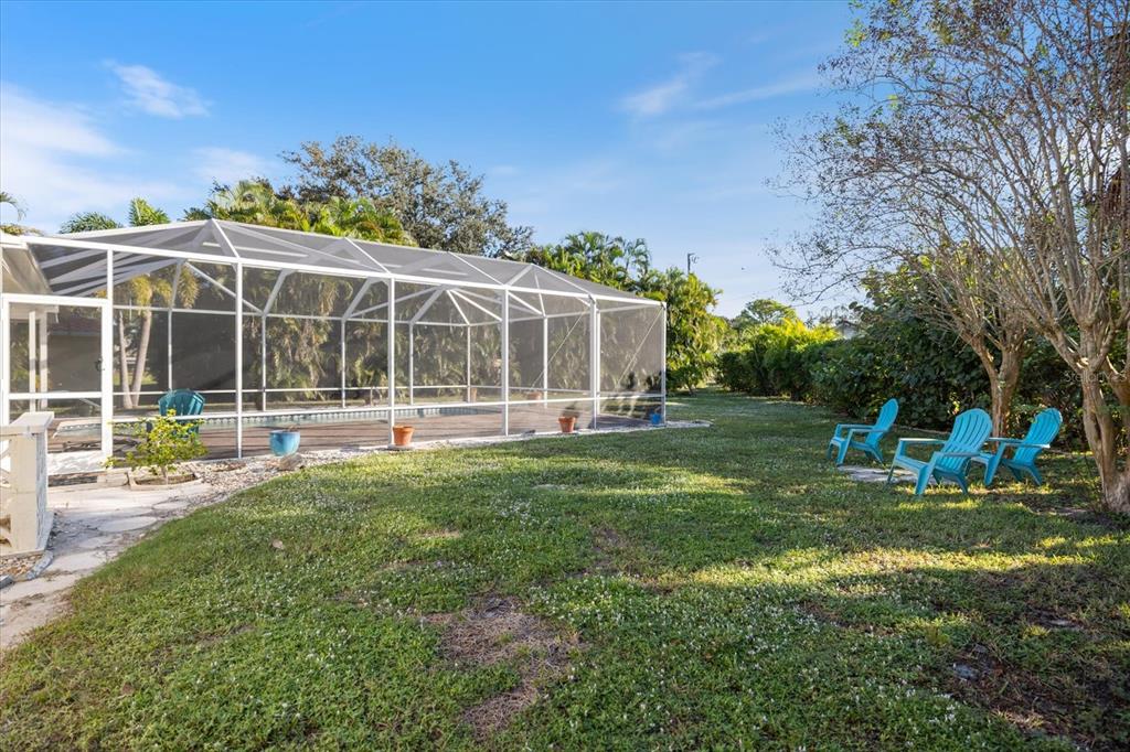 470 Leger Drive Nokomis, FL 34275 - Photo 43 of 51 a view of a house with backyard sitting area and garden
