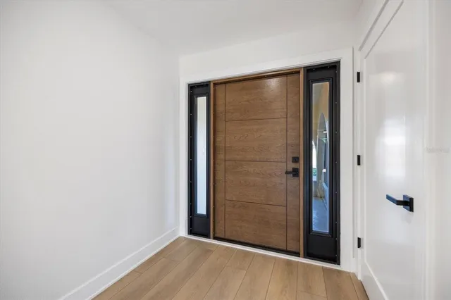 a kitchen with refrigerator and cabinets