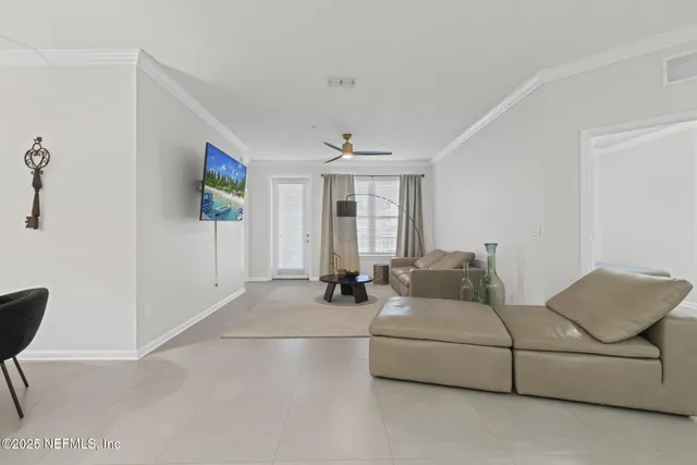 a living room with furniture and a window
