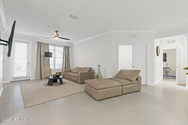 a living room with furniture and a window