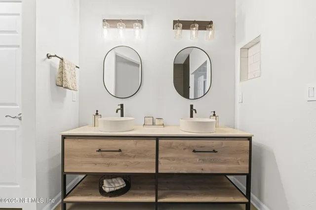 a bathroom with a glass shower door