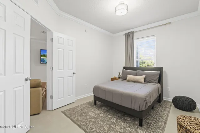 a bedroom with a bed and a cabinets