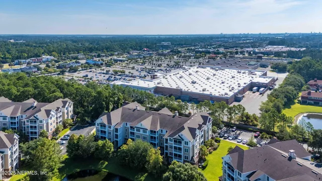 an aerial view of a house with a garden and plants