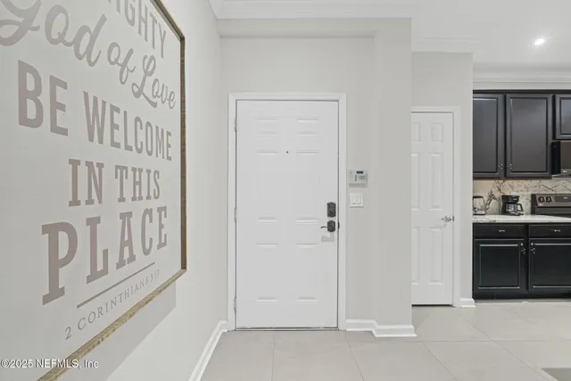 a kitchen with granite countertop a refrigerator stove top oven and sink