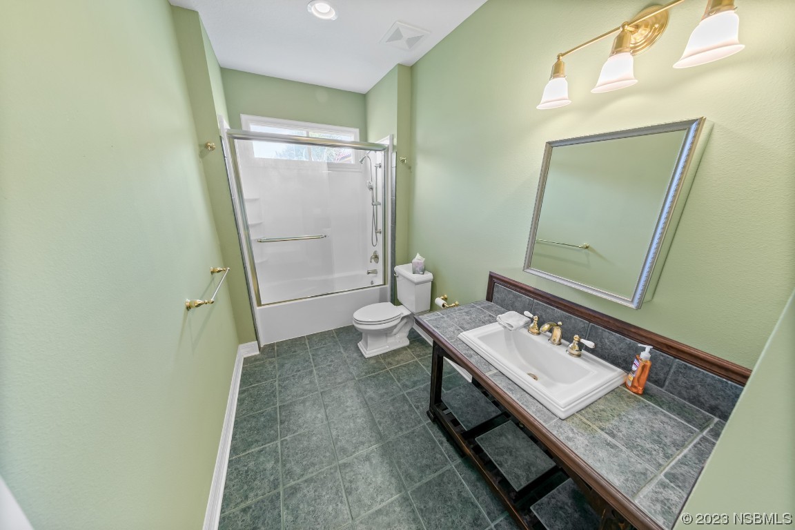 33 Calumet Avenue Ponce Inlet, FL 32127 - Photo 40 of 48 a view of a bathroom with a sink and a mirror