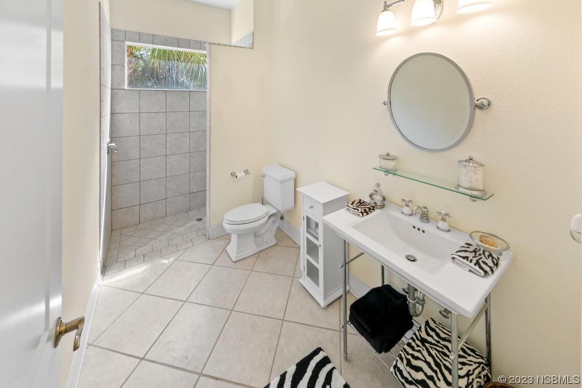 33 Calumet Avenue Ponce Inlet, FL 32127 - Photo 44 of 48 a bathroom with a sink mirror and toilet