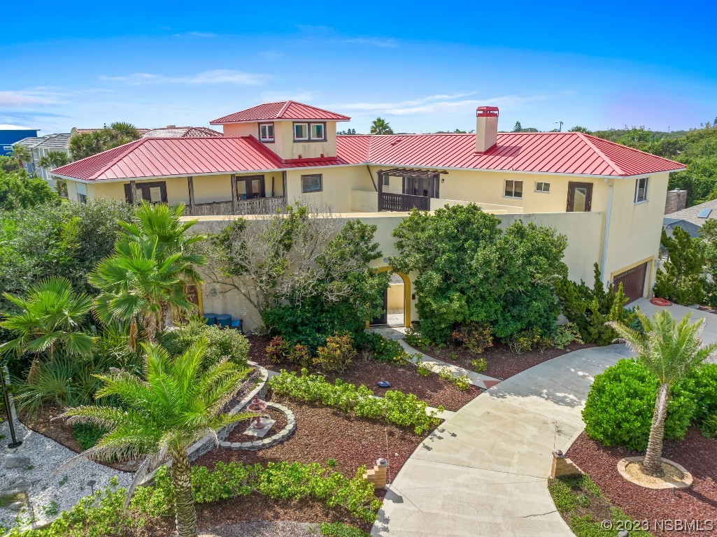 33 Calumet Avenue Ponce Inlet, FL 32127 - Photo 46 of 48 a view of a house with a yard and potted plants