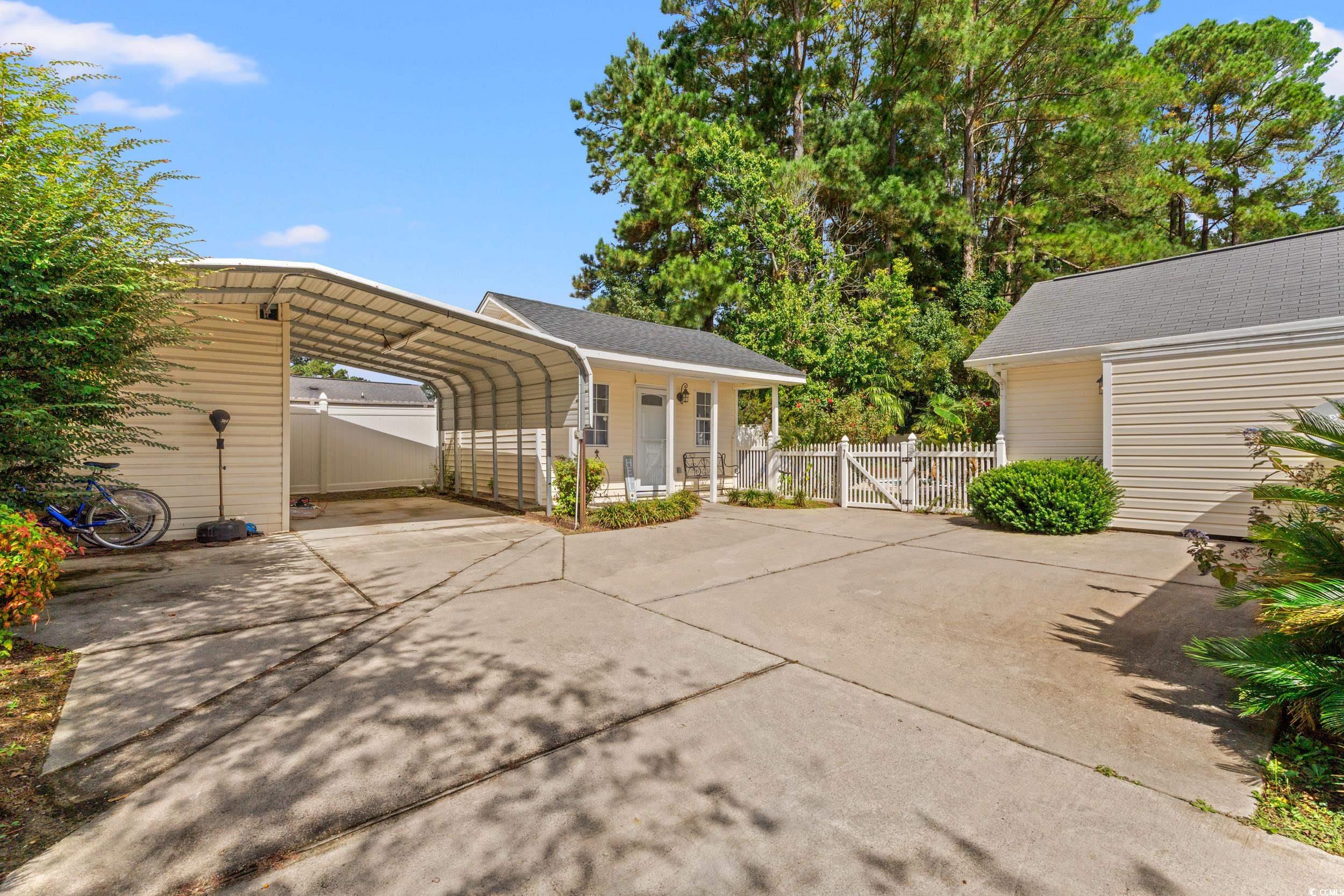 3056 Sweetpine Lane Conway, SC 29527 - Photo 35 of 36 Fenced backyard with french doors and a patio
