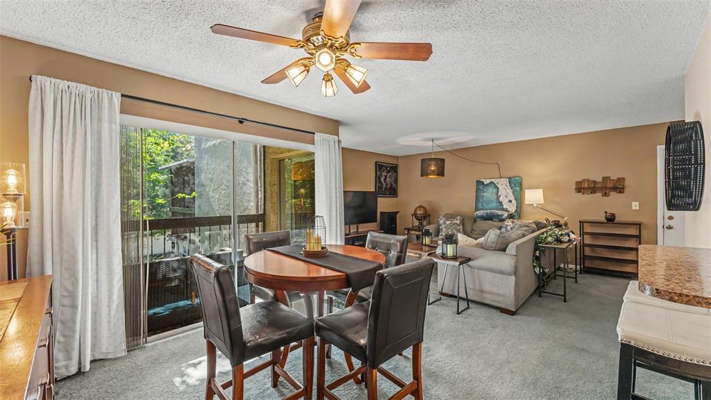 2025 Sylvester Road, Unit N305 Lakeland, FL 33803 - Photo 19 of 34 a view of a dining room with furniture window and outside view