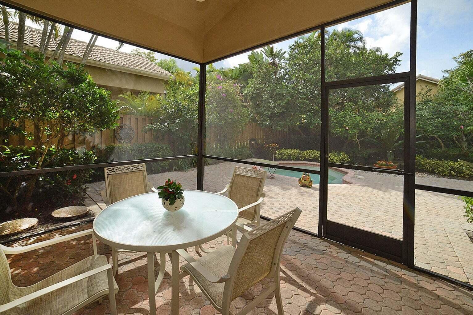 6695 Northwest 25th Court Boca Raton, FL 33496 - Photo 22 of 40 a dining room with a table and chairs