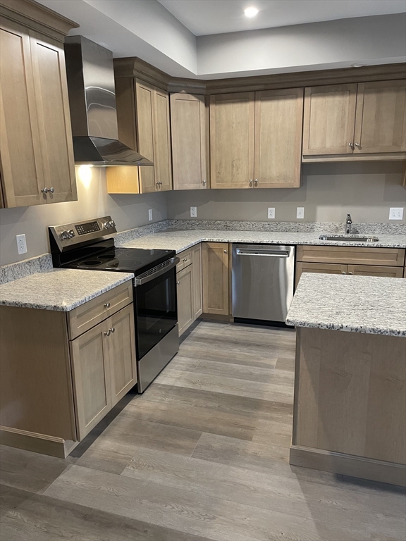 1 Brattle Street, Unit 1 Worcester, MA 01606 - Photo 6 of 21 a kitchen with a stove top oven sink and cabinets