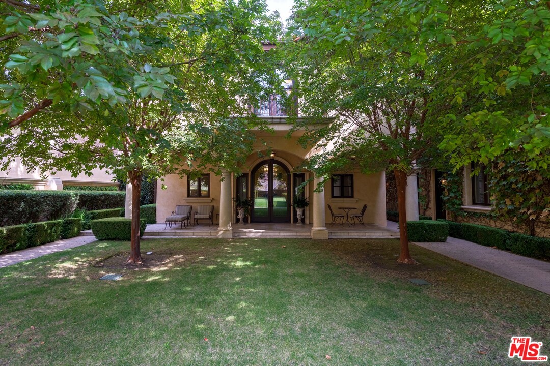 44 Beverly Park Circle Beverly Hills, CA 90210 - Photo 6 of 17 a view of a house with a yard and tree s