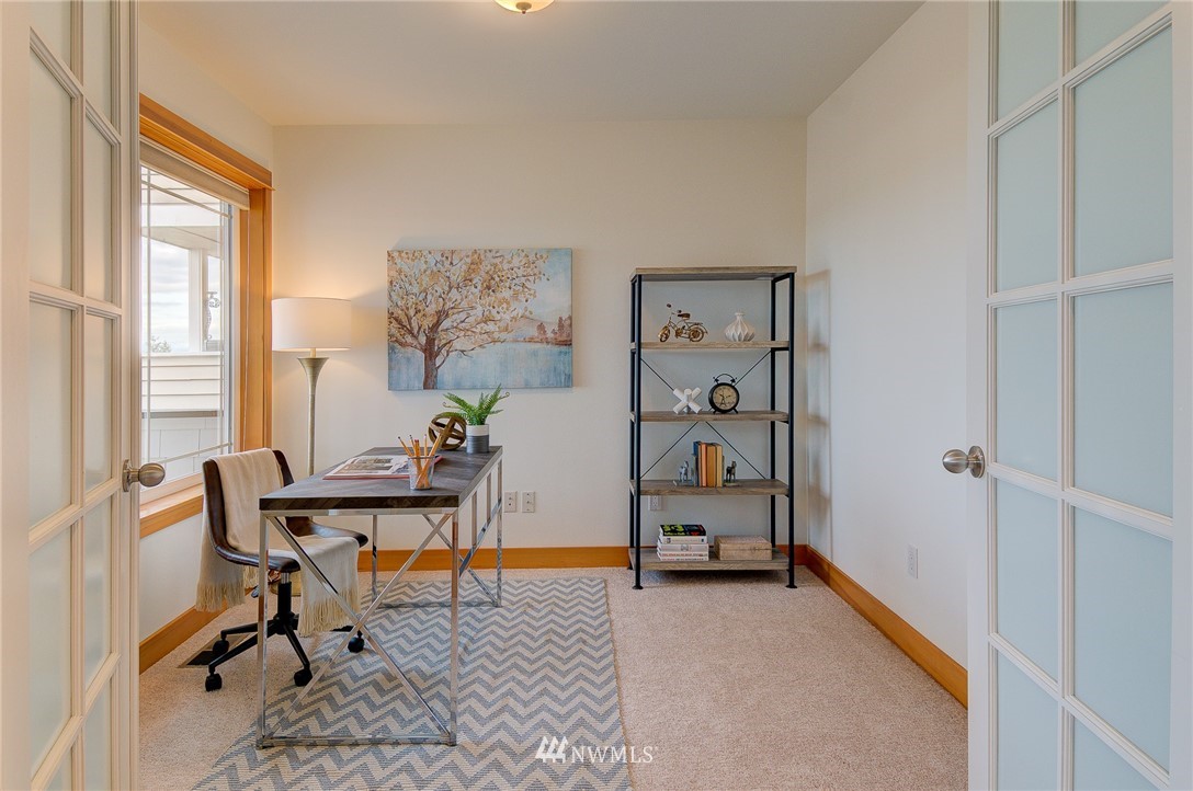 6734 Mars Avenue South Seattle, WA 98108 - Photo 15 of 40 a view of a workspace with furniture and a window