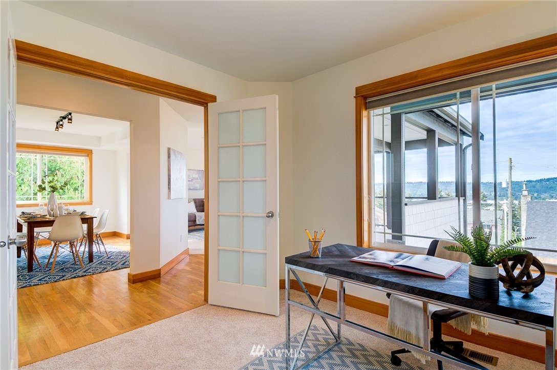 6734 Mars Avenue South Seattle, WA 98108 - Photo 16 of 40 a view of a livingroom with furniture and floor to ceiling window
