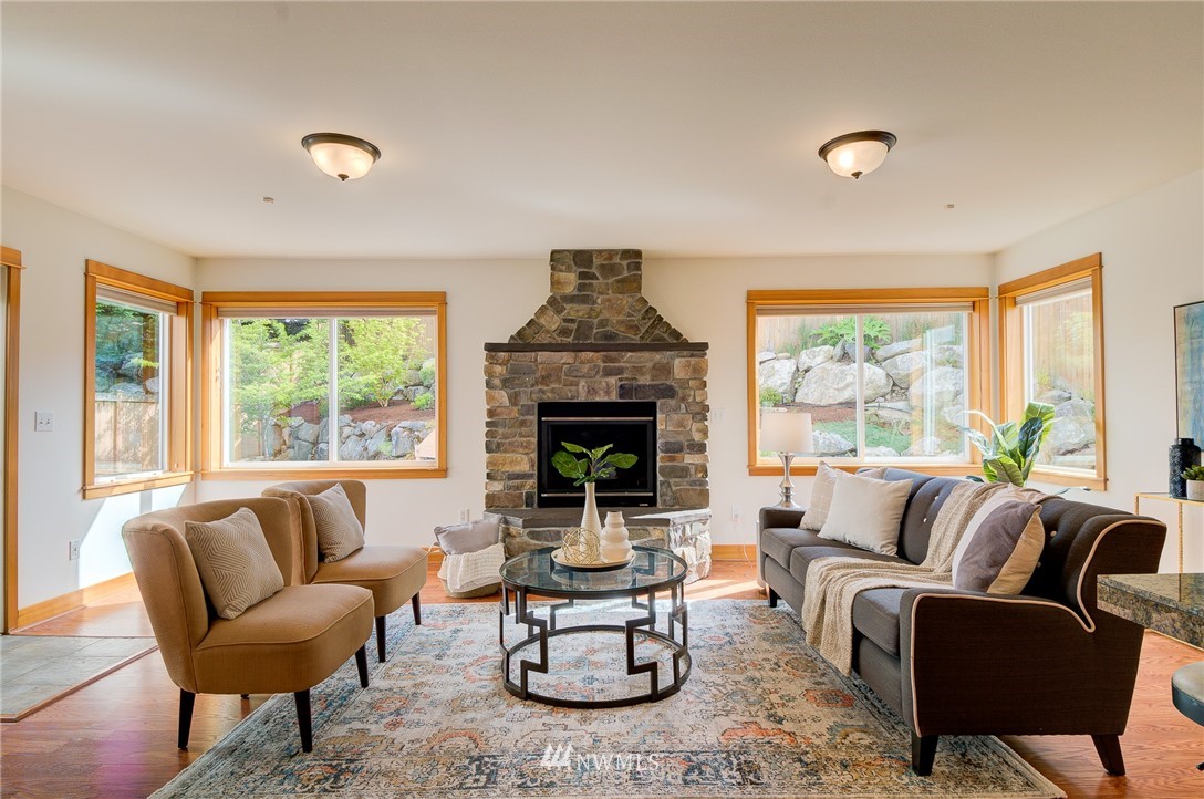 6734 Mars Avenue South Seattle, WA 98108 - Photo 17 of 40 a living room with furniture a fireplace and a large window