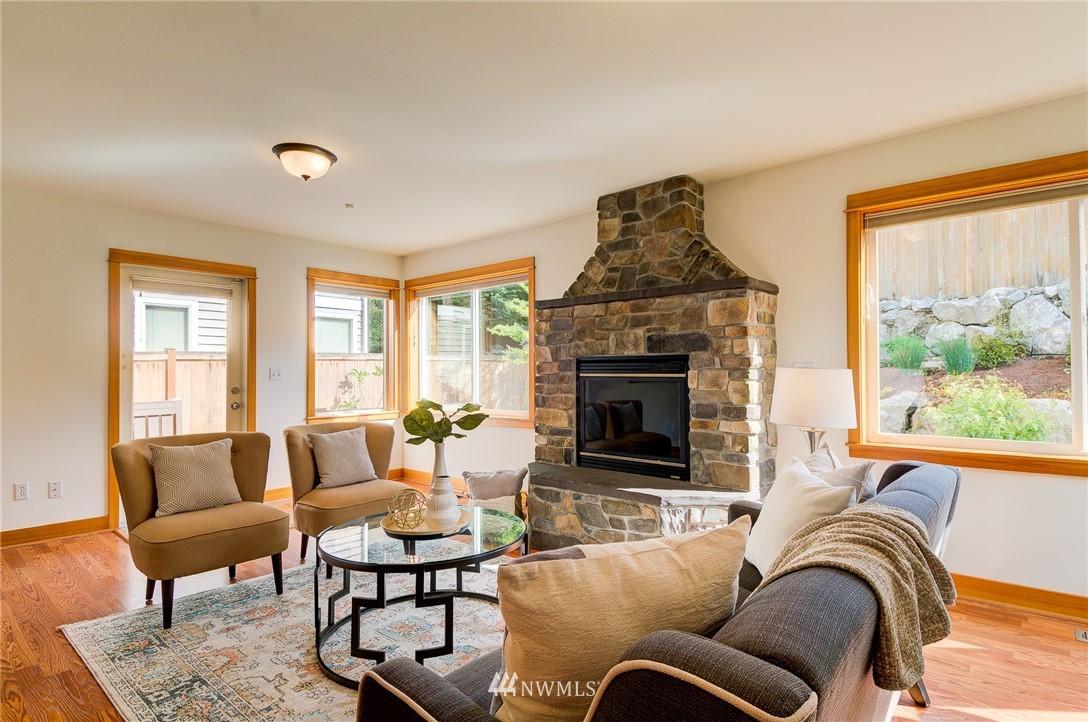6734 Mars Avenue South Seattle, WA 98108 - Photo 19 of 40 a living room with furniture fireplace and a large window