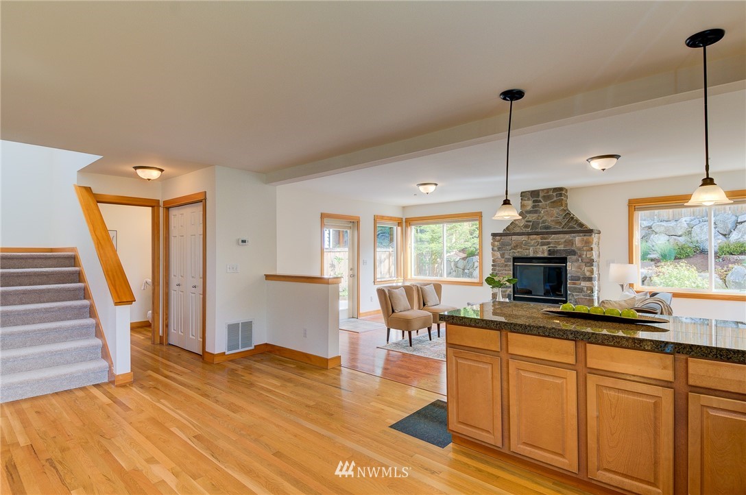 6734 Mars Avenue South Seattle, WA 98108 - Photo 20 of 40 a kitchen with a sink stove and wooden floor