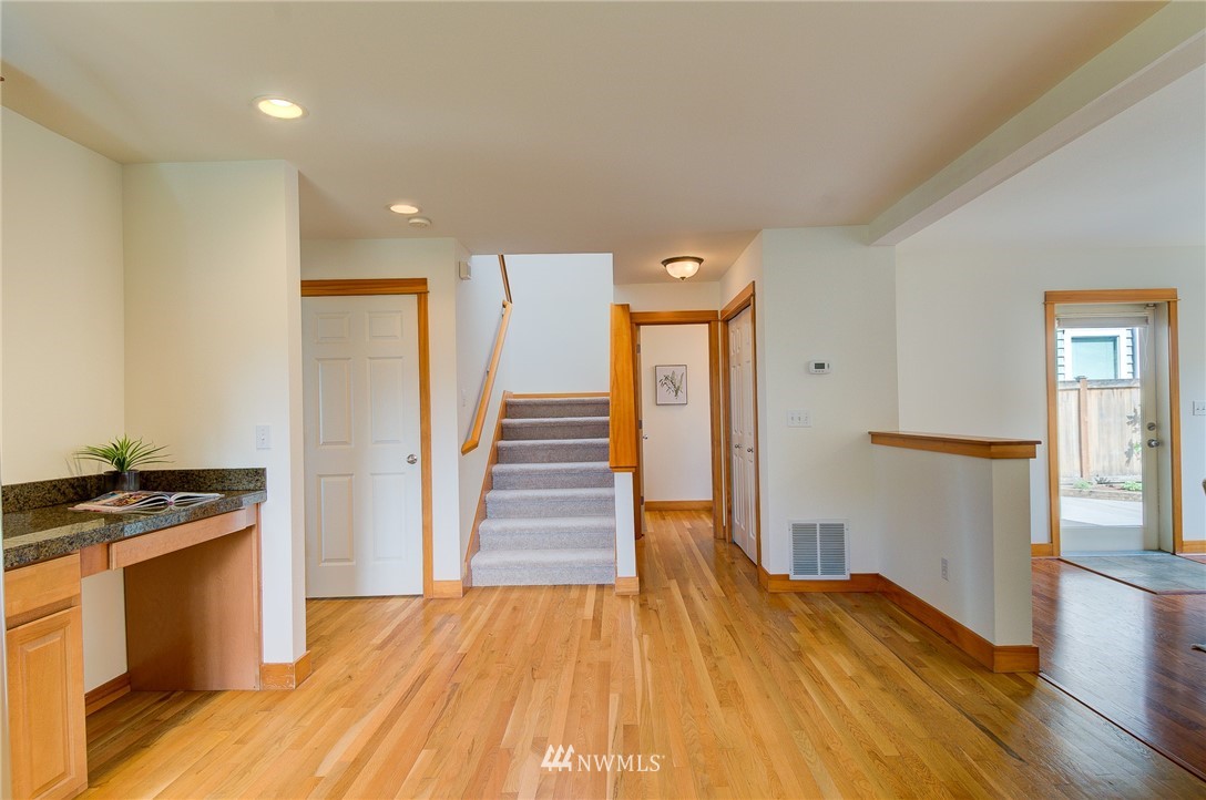 6734 Mars Avenue South Seattle, WA 98108 - Photo 21 of 40 a view of a kitchen with wooden floor and electronic appliances