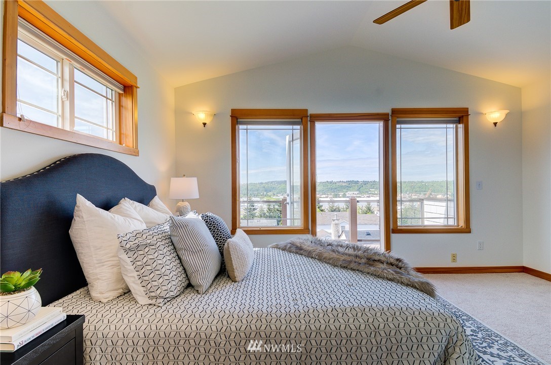 6734 Mars Avenue South Seattle, WA 98108 - Photo 26 of 40 a bedroom with bed and a large window