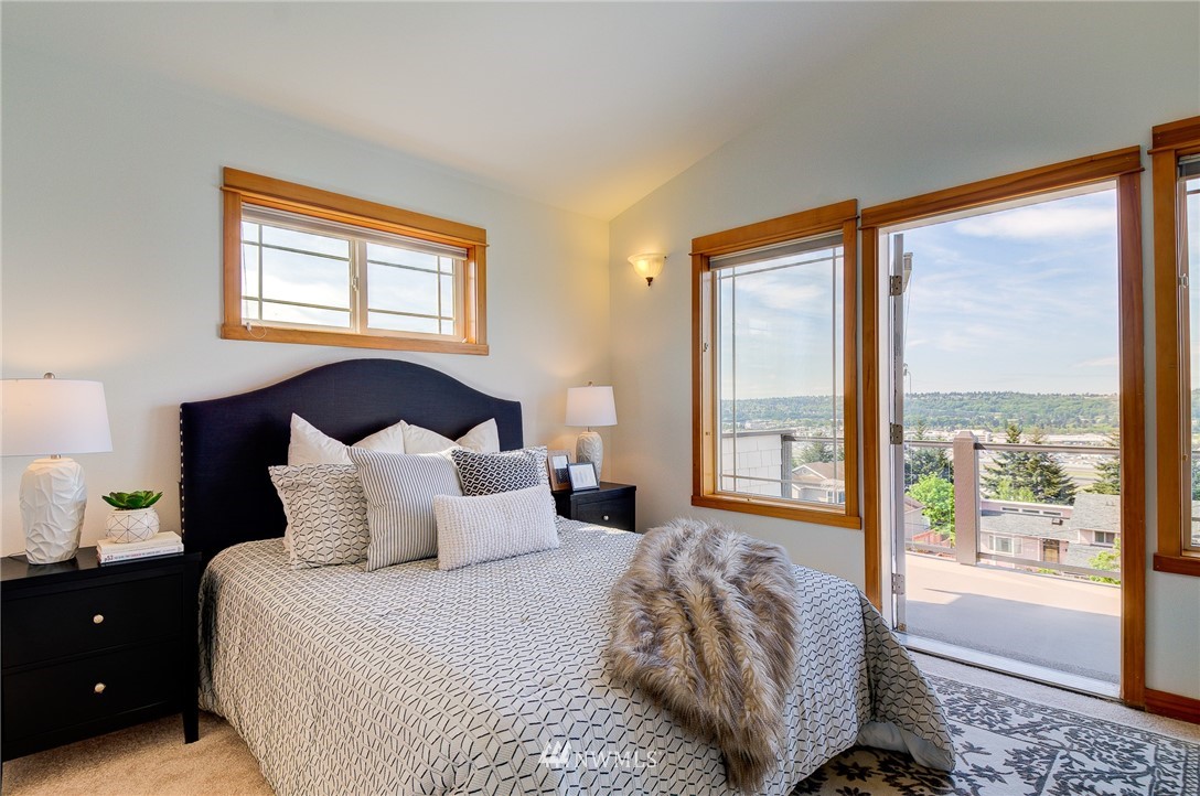 6734 Mars Avenue South Seattle, WA 98108 - Photo 27 of 40 a bedroom with a large bed and a window