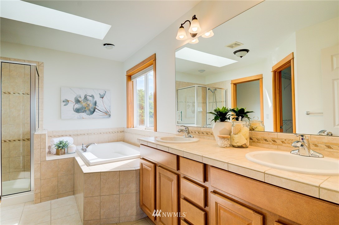 6734 Mars Avenue South Seattle, WA 98108 - Photo 29 of 40 a bathroom with a granite countertop sink and a window