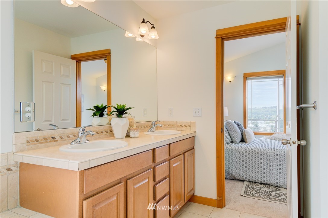 6734 Mars Avenue South Seattle, WA 98108 - Photo 31 of 40 a en suite bathroom with a sink and a mirror