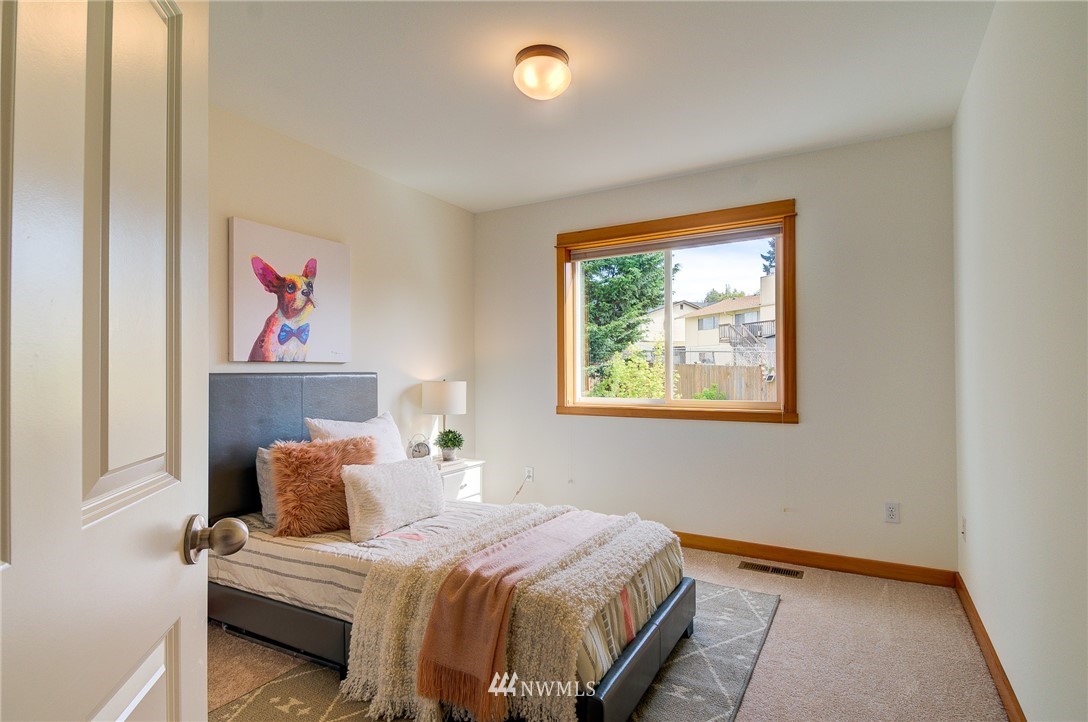 6734 Mars Avenue South Seattle, WA 98108 - Photo 33 of 40 a bedroom with a bed and a window