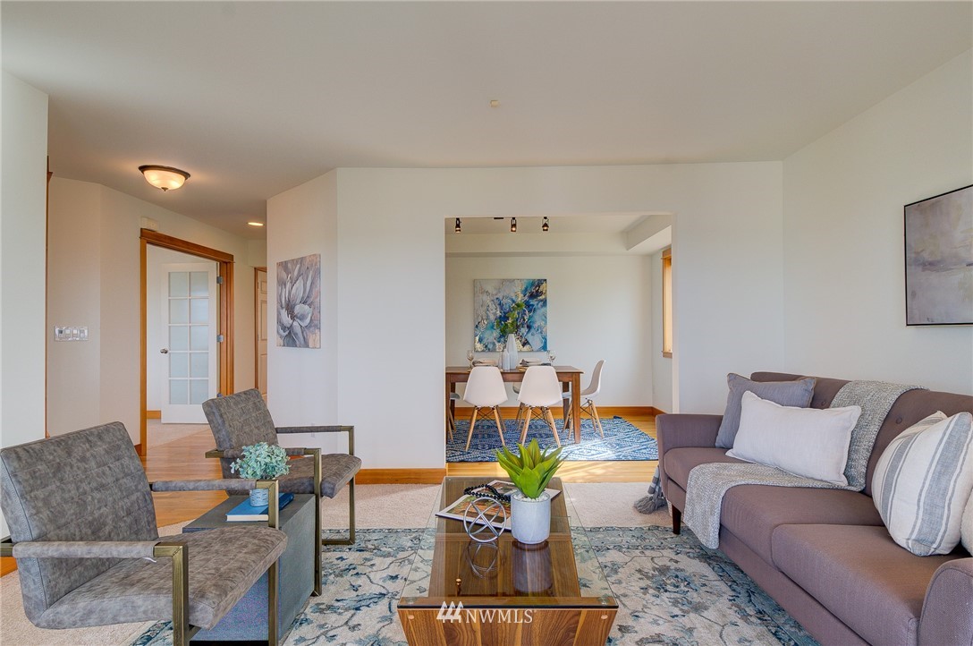 6734 Mars Avenue South Seattle, WA 98108 - Photo 5 of 40 a living room with furniture and a dining table