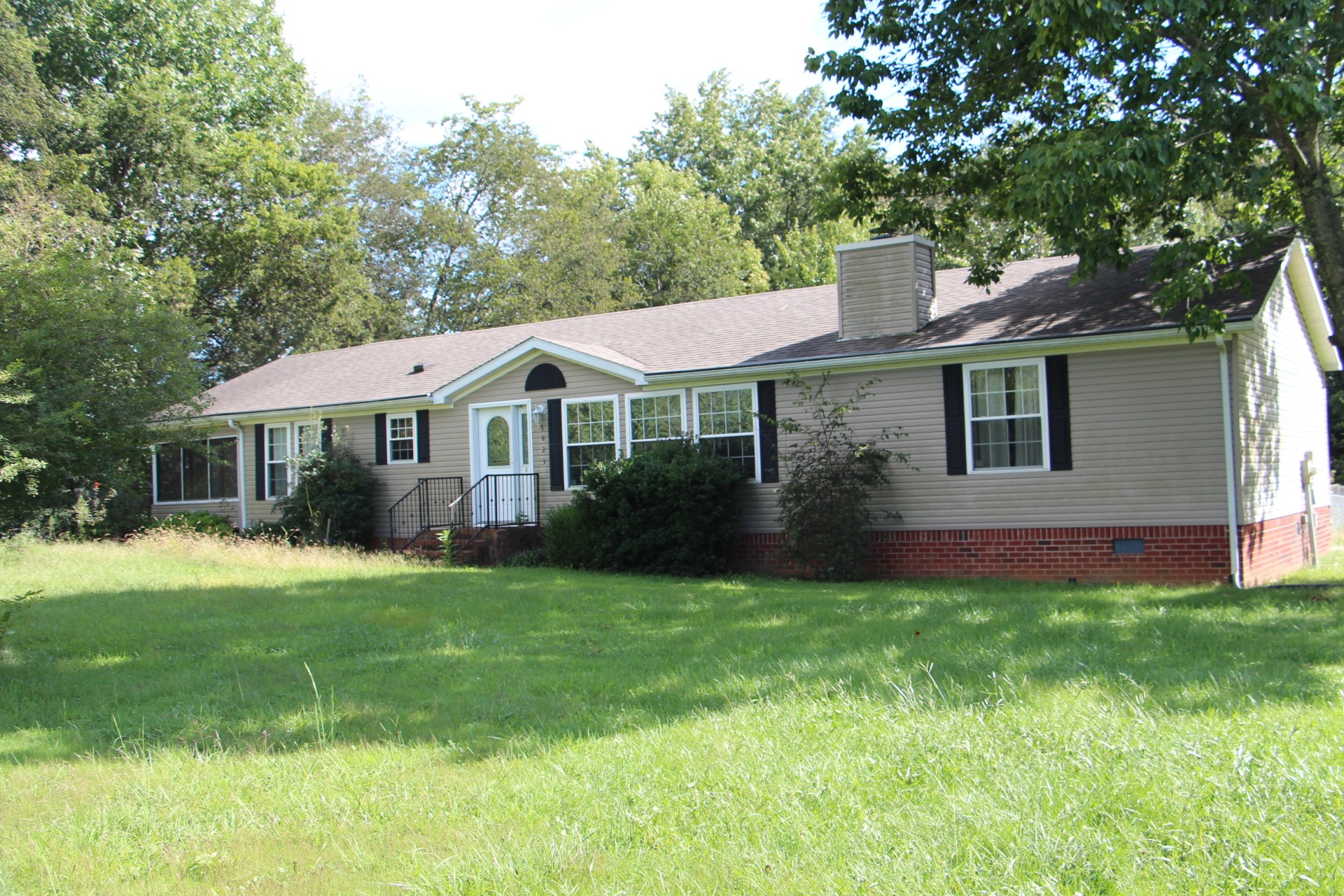 12869 Owens Chapel Road Springfield, TN 37172 - Photo 8 of 36 a front view of a house with a garden