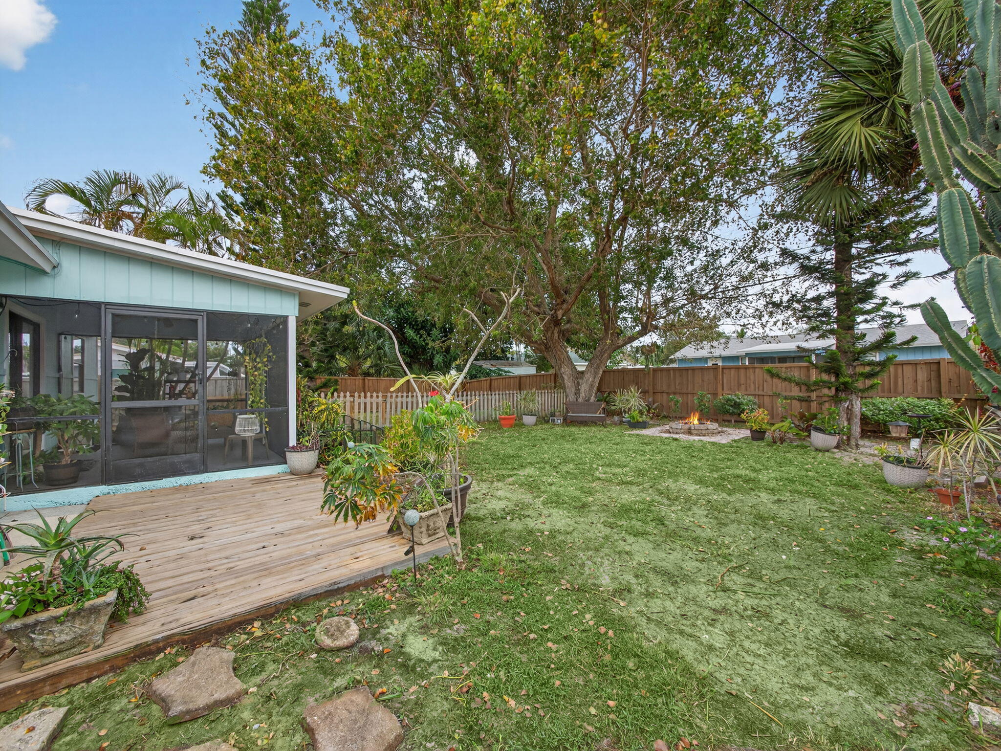 991 Northwest 15th Terrace Stuart, FL 34994 - Photo 20 of 24 a front view of a house with garden