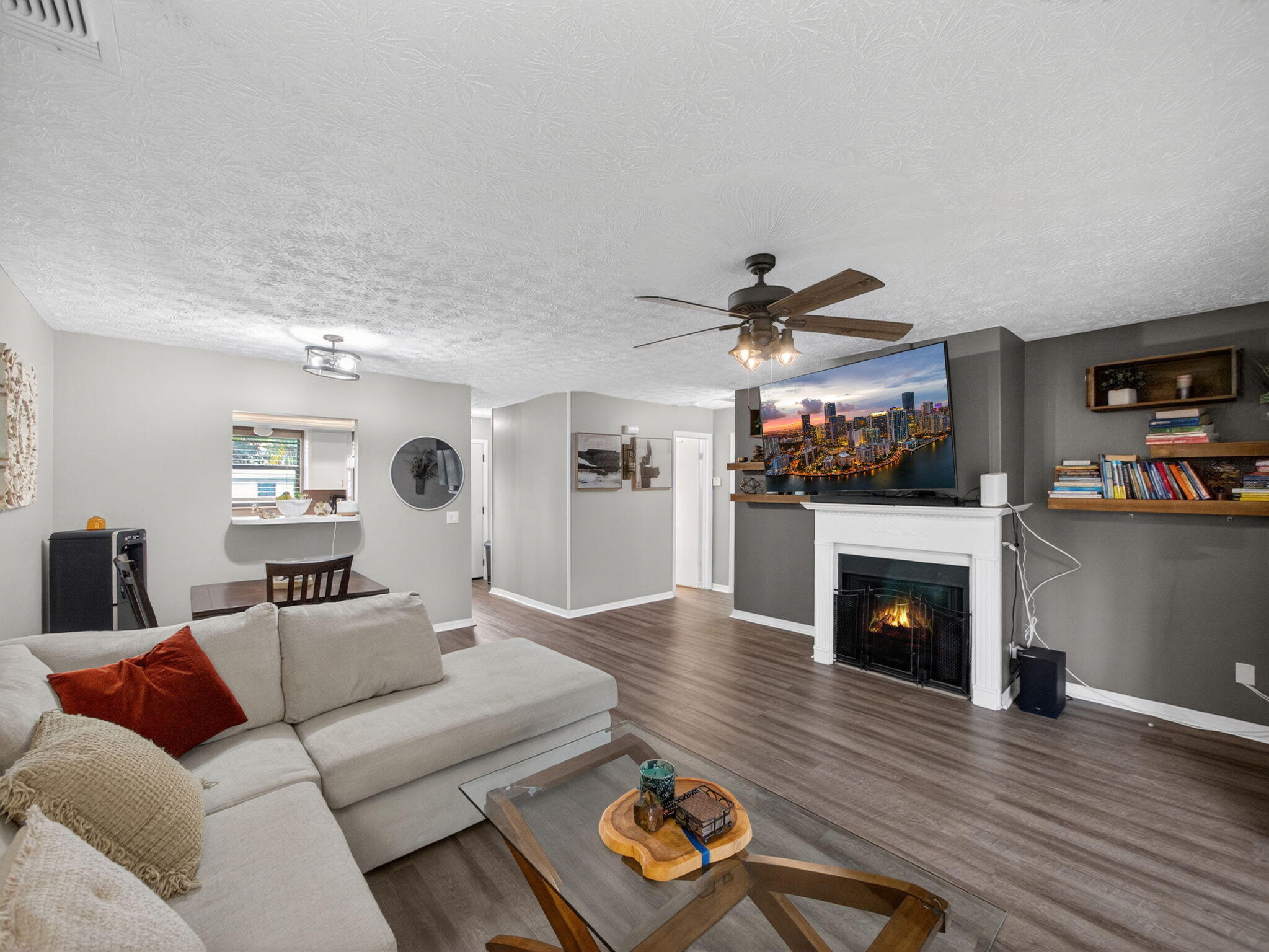 991 Northwest 15th Terrace Stuart, FL 34994 - Photo 9 of 24 a living room with furniture and a fireplace