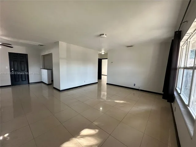 a view of a livingroom with a staircase