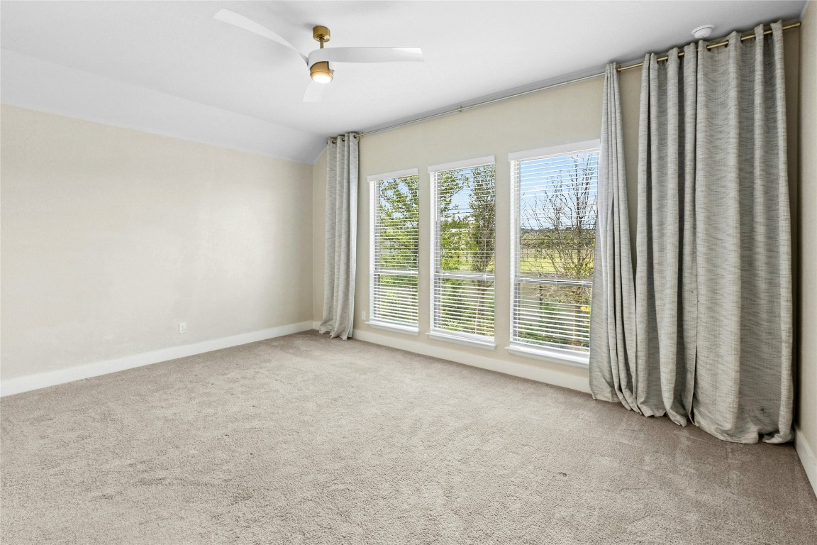 1121 Spring Gulch Lane Georgetown, TX 78628 - Photo 13 of 33 a view of room with window and ceiling fan