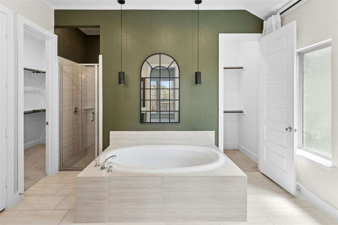 1121 Spring Gulch Lane Georgetown, TX 78628 - Photo 16 of 33 a spacious bathroom with a bathtub and a shower