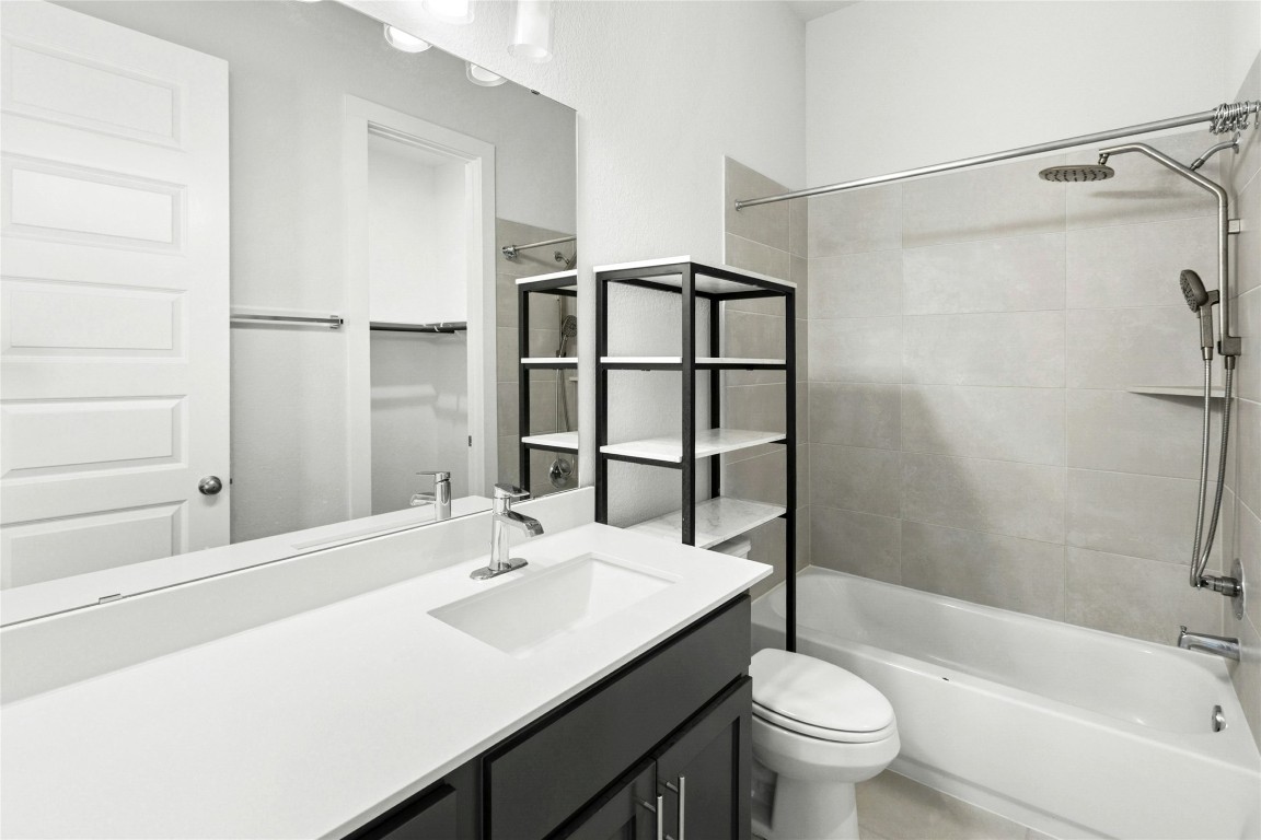 1121 Spring Gulch Lane Georgetown, TX 78628 - Photo 19 of 33 a bathroom with a sink toilet tub and shower