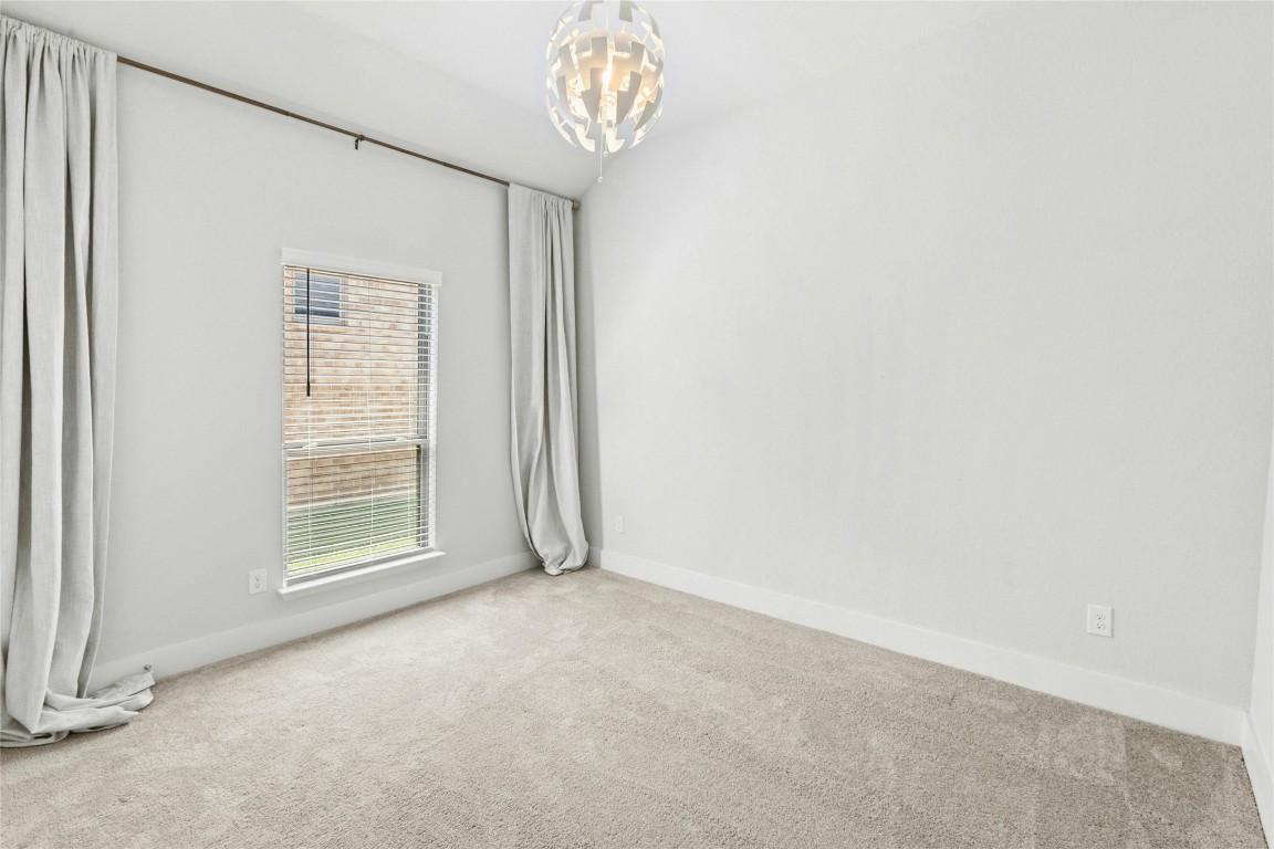1121 Spring Gulch Lane Georgetown, TX 78628 - Photo 21 of 33 a view of an empty room with a window