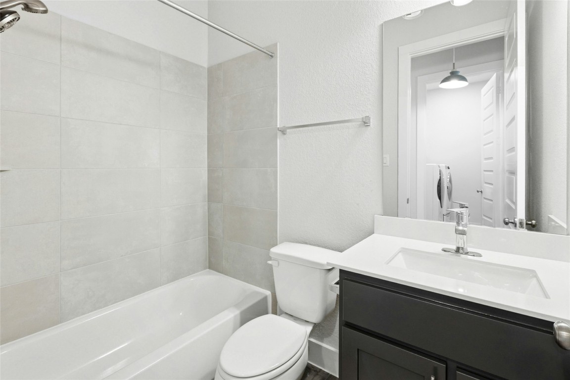 1121 Spring Gulch Lane Georgetown, TX 78628 - Photo 22 of 33 a bathroom with a sink toilet and shower