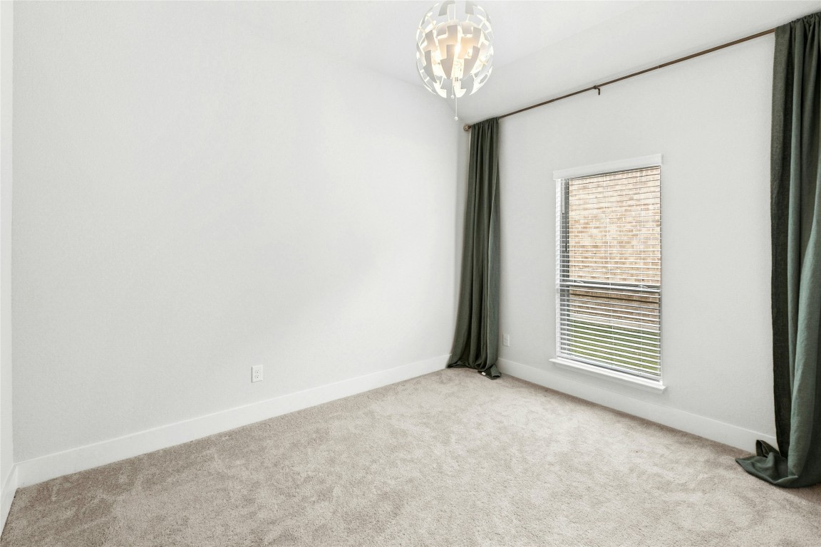 1121 Spring Gulch Lane Georgetown, TX 78628 - Photo 23 of 33 a view of an empty room with a window