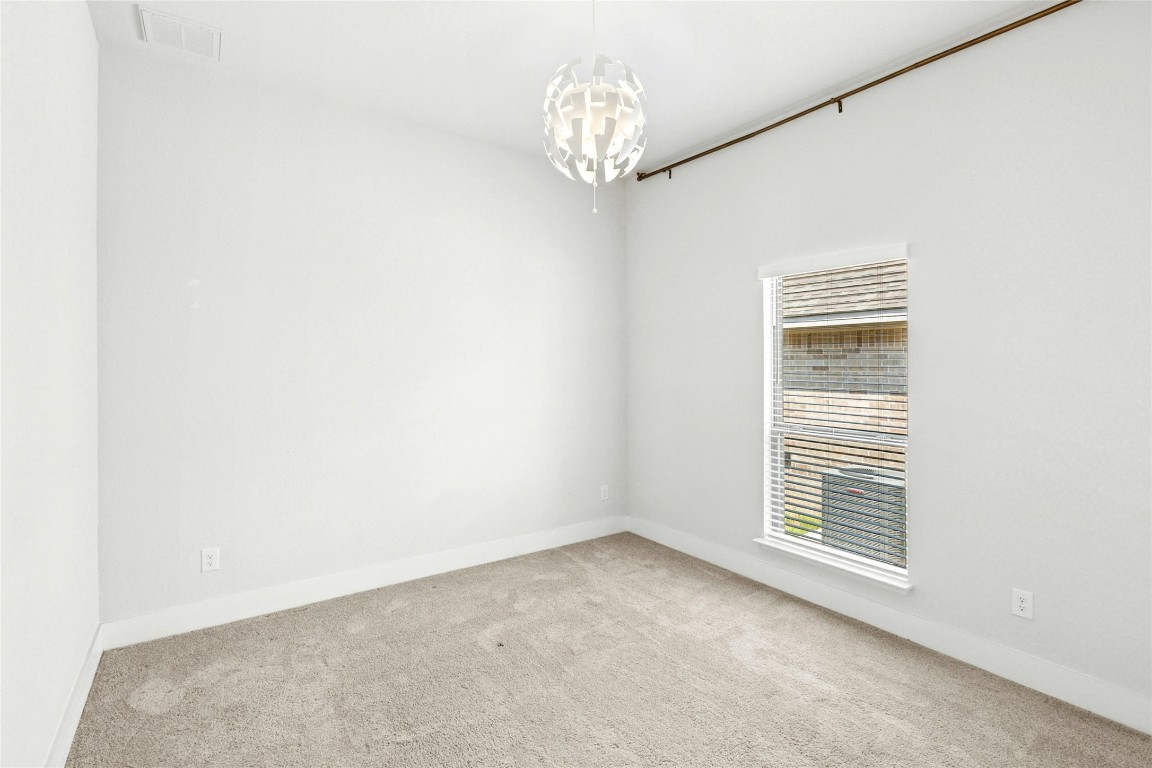 1121 Spring Gulch Lane Georgetown, TX 78628 - Photo 24 of 33 a view of an empty room with a window