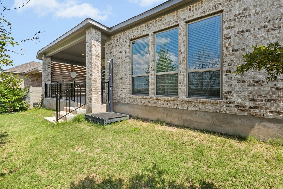 1121 Spring Gulch Lane Georgetown, TX 78628 - Photo 27 of 33 a view of a house with backyard and porch