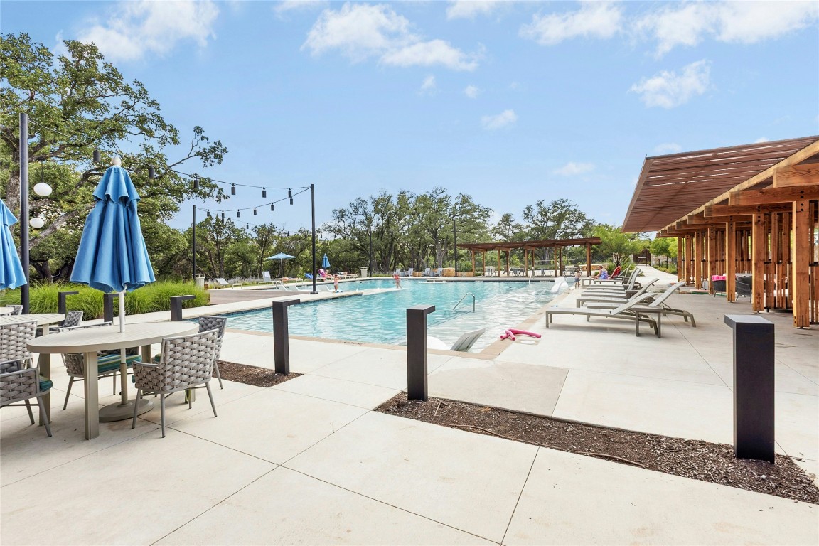 1121 Spring Gulch Lane Georgetown, TX 78628 - Photo 30 of 33 a view of a patio with couches and table and chairs and potted plants