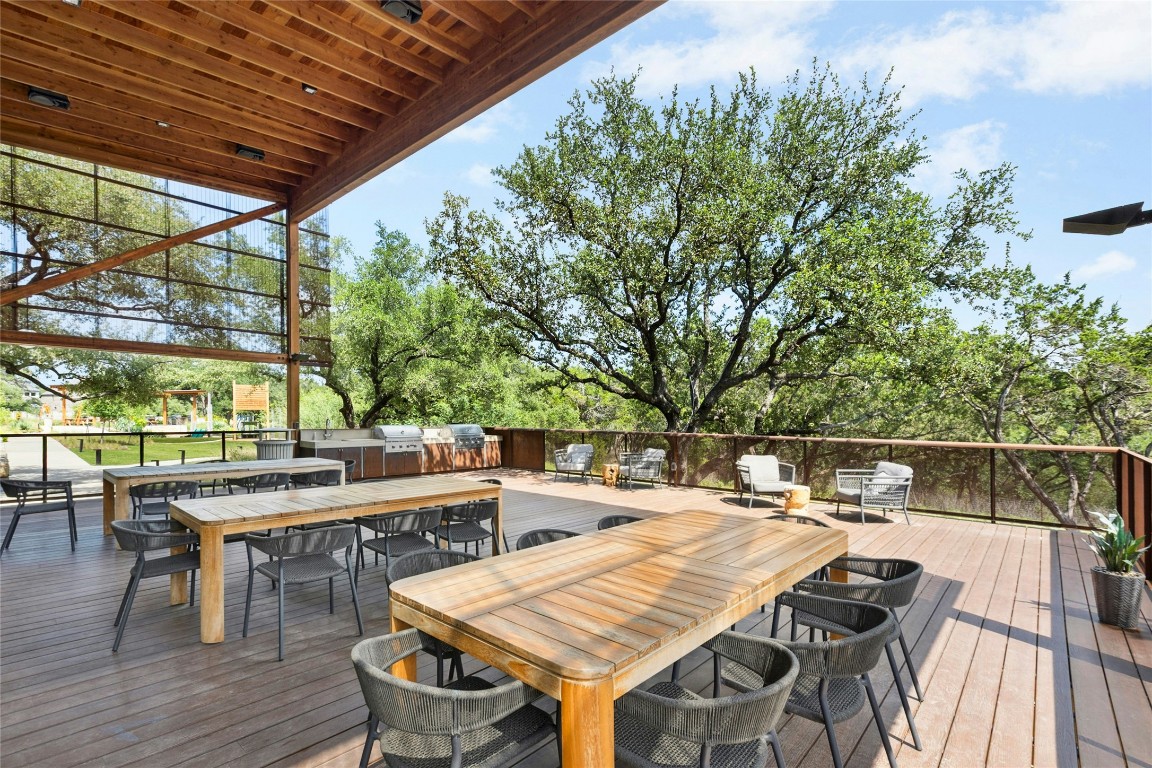 1121 Spring Gulch Lane Georgetown, TX 78628 - Photo 31 of 33 a view of a patio with table and chairs and wooden floor