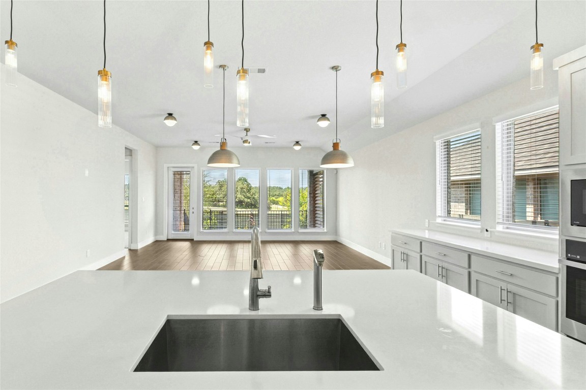 1121 Spring Gulch Lane Georgetown, TX 78628 - Photo 10 of 33 a large white kitchen with a large window