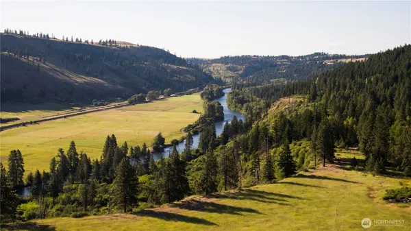 a view of a swimming pool with a house in the background
