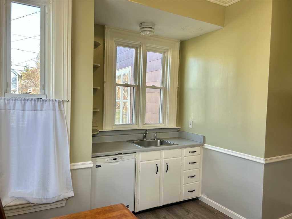 48 Congress Street Greenfield, MA 01301 - Photo 26 of 36 a bathroom with a granite countertop sink a mirror and a shower
