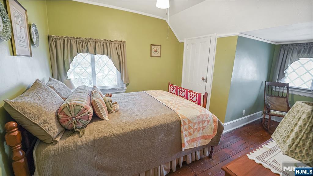 695 Ramapo Valley Road Oakland, NJ 07436 - Photo 28 of 42 a bedroom with a bed and wooden floor