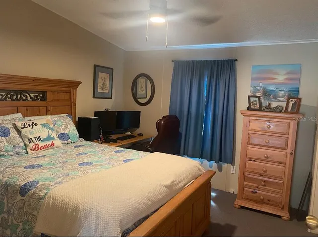 a bedroom with a bed and a closet