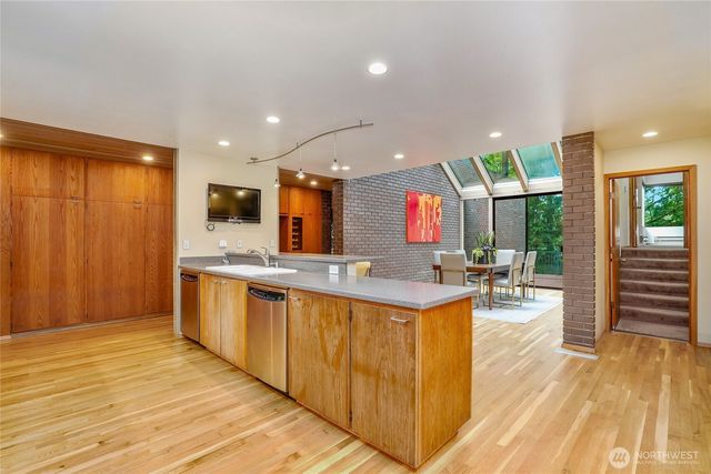 a kitchen with lots of counter top space and living room