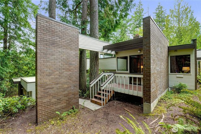 a view of porch with a patio and a garden
